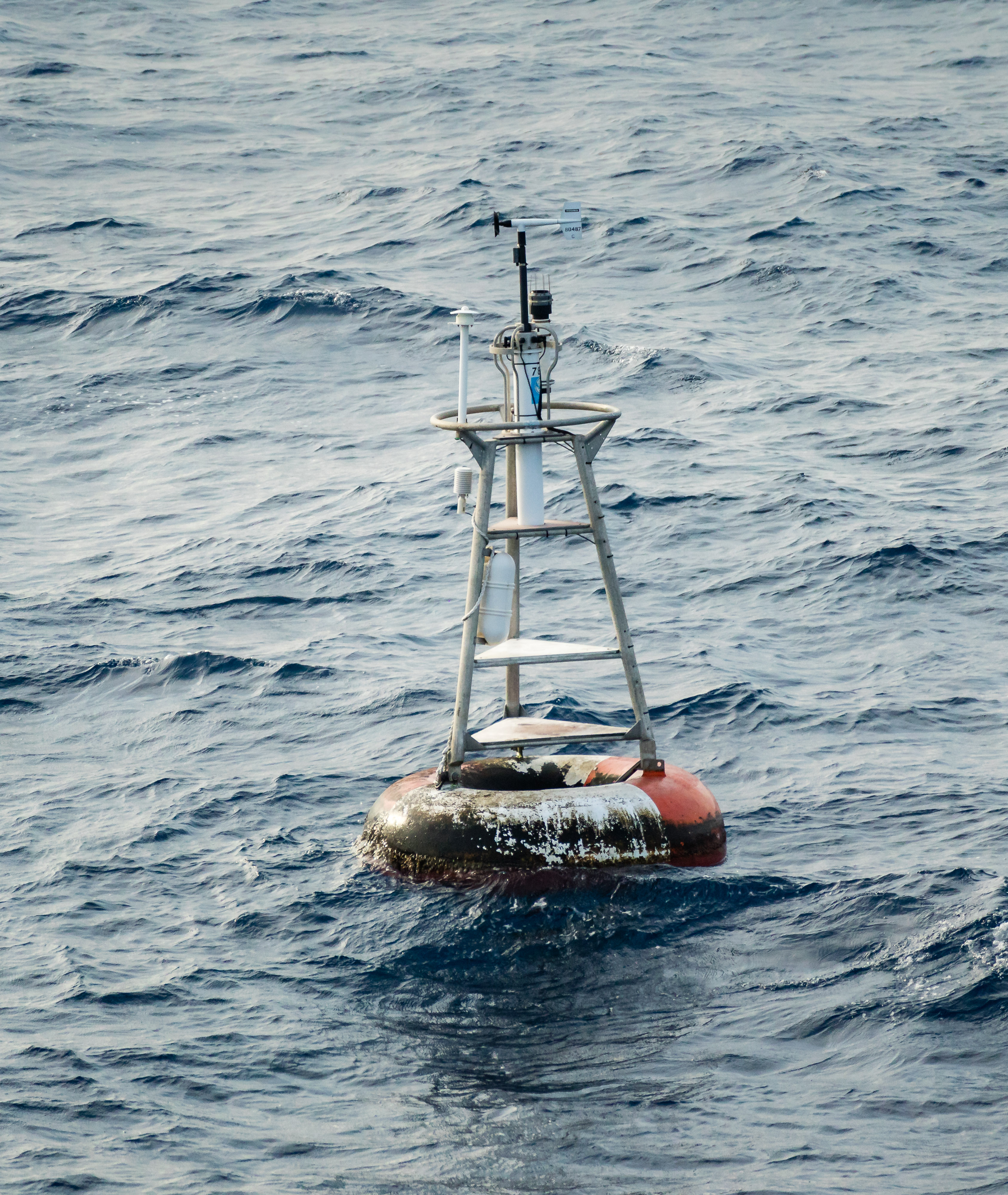 Buoy weather station in the ocean marking 0,0 