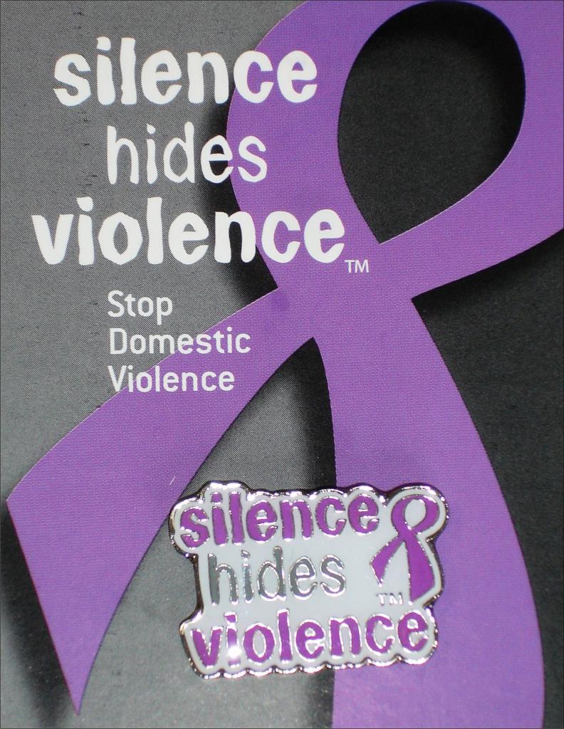 pin that reads 'Silence hides violence'