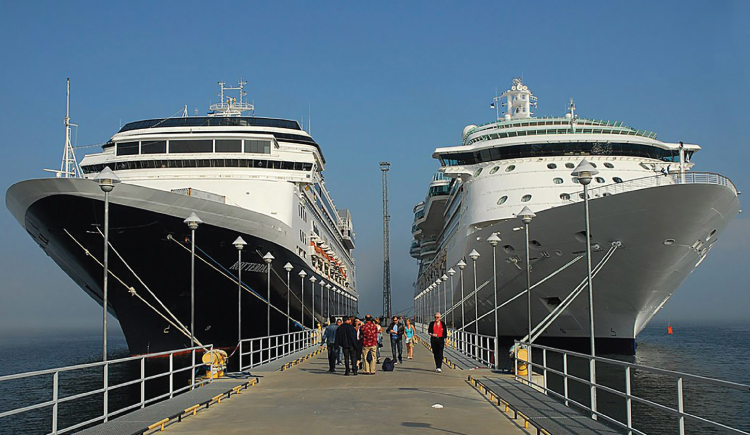 Figure 12.3. Cruise ships docked at a Caribbean port. Sgbirch, CC BY 2.0.