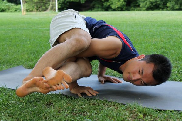 A man in a yoga pose.