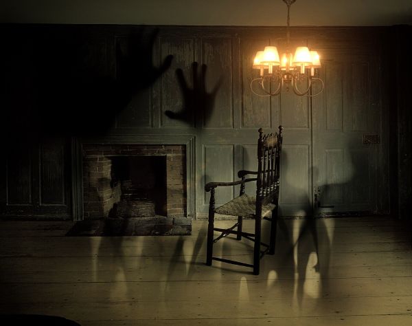 Shadows lurking in a dark room.