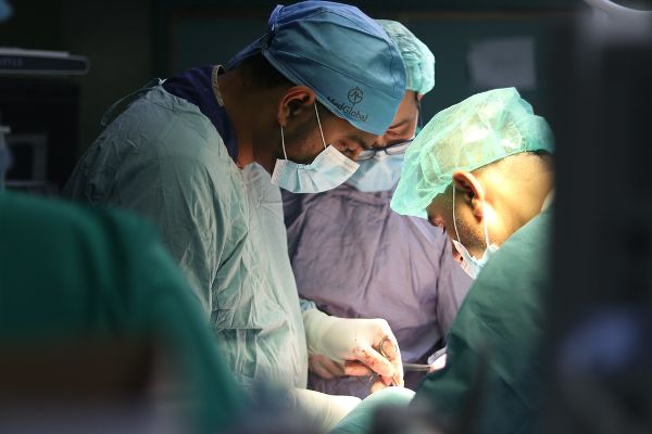 A surgeon and the medical team in surgery.