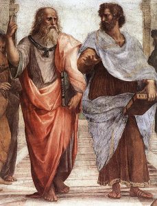 Painting of Plato by Raphael. Plato is wearing a pink-orange robe on the right and has a beard.