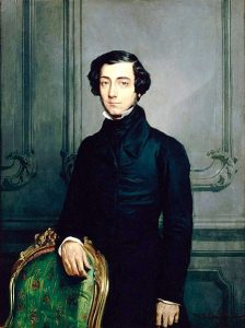 Painting of Alexis de Tocqueville wearing a black coat standing next to a green chair.