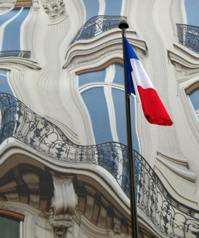 Distorted view of a building with a flag in front that is not distorted