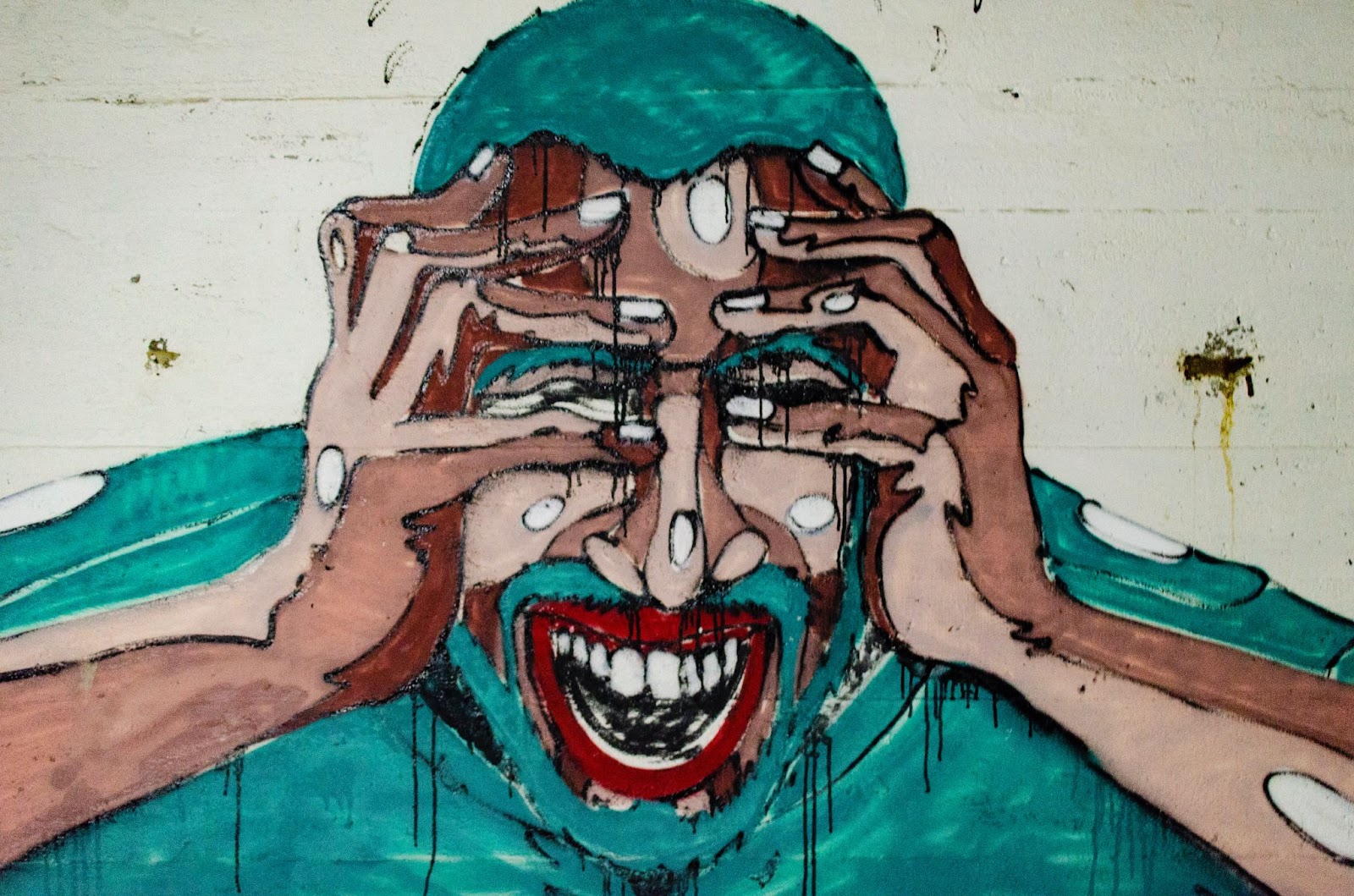 A painting of a person holding their face and screaming