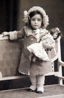 little girl with her baby doll