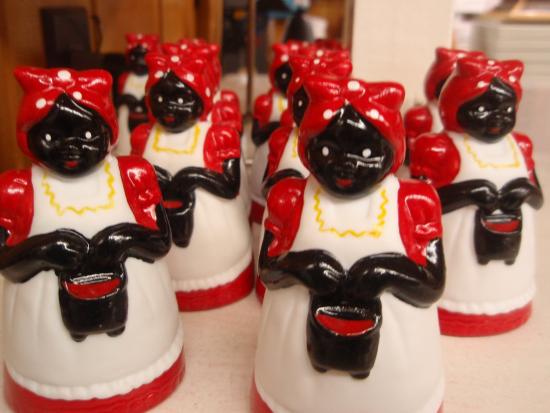 mammy figurines of Black women maids wearing red and white dresses and headscarfs
