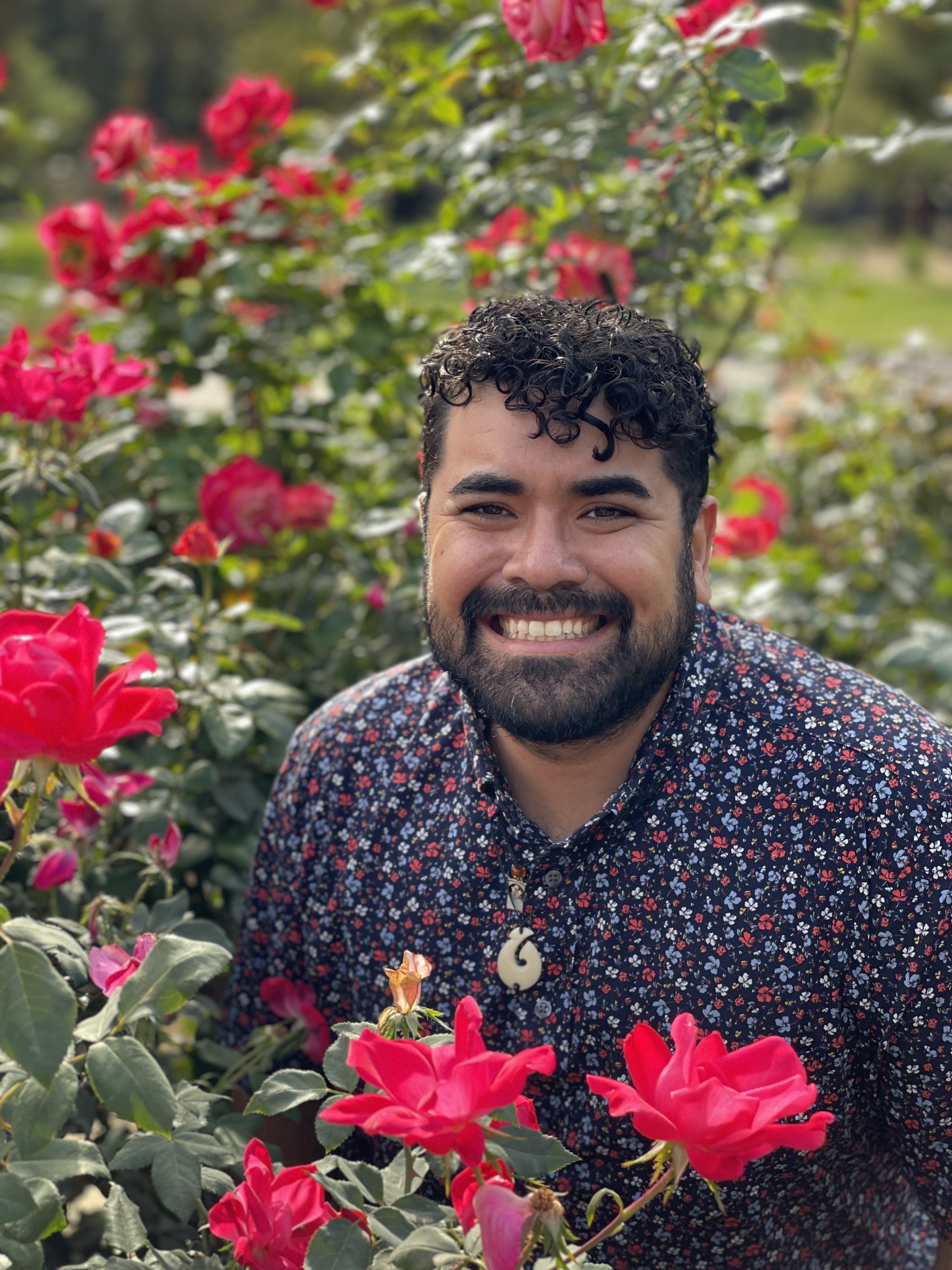 Dr. Mario Alberto Viveros Espinoza-Kulick in a field of pink roses