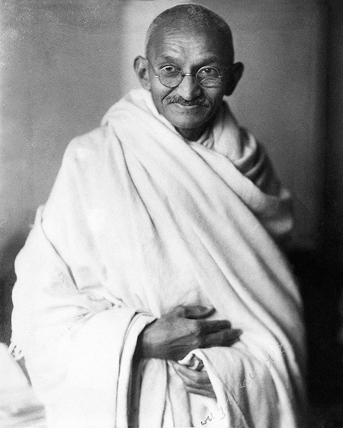 A photograph of Mohandas Ghandi.