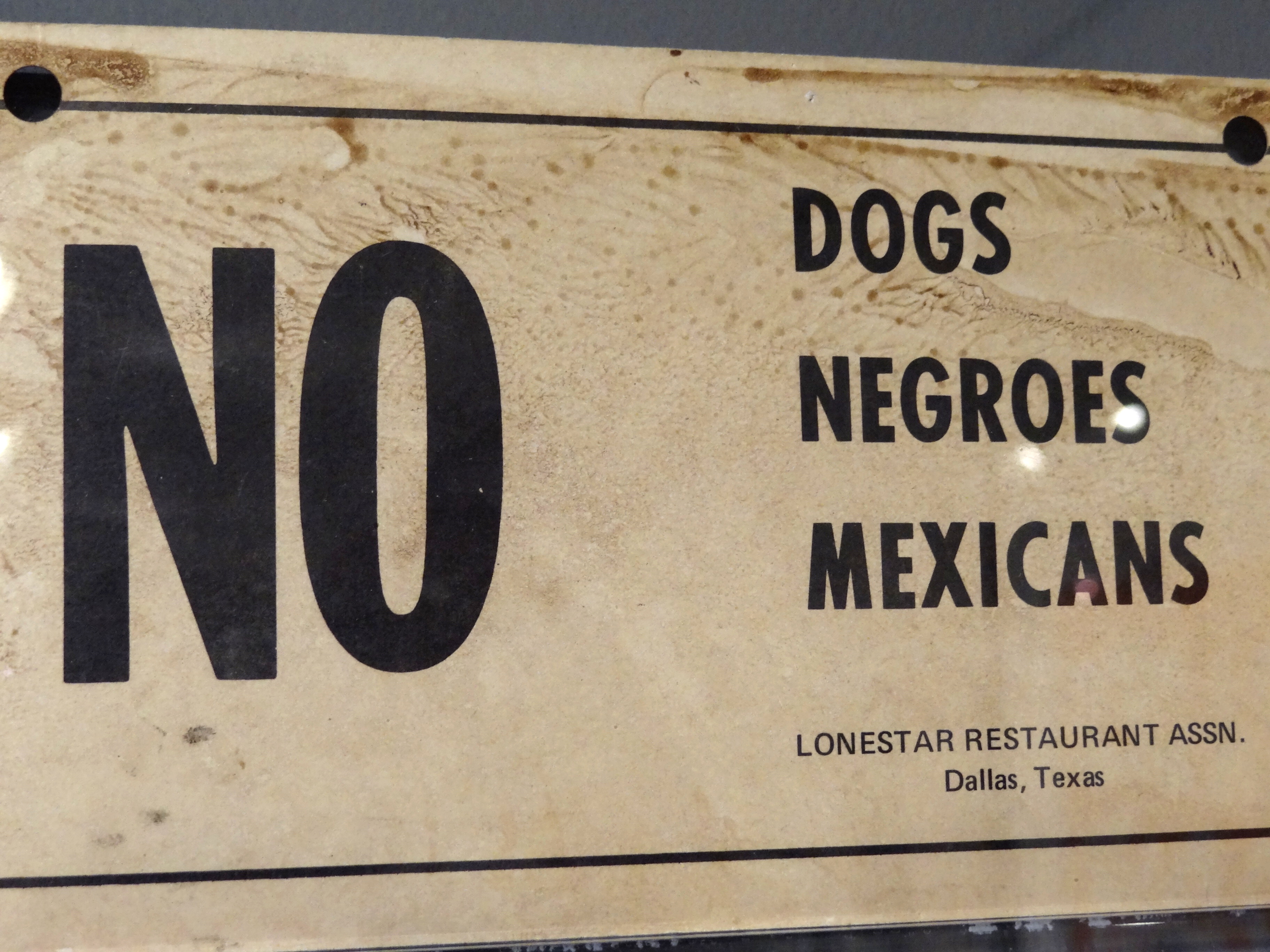 Racist sign from Memphis, Tennessee that reads, “No Dogs, Negroes, Mexicans. Lonestar Restaurant Assn. Dallas, Texas.”