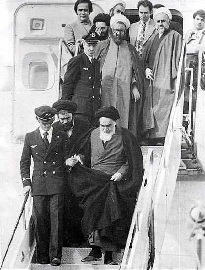 Ayatollah Khomeini descending airplane stairs upon return to Iran in 1979
