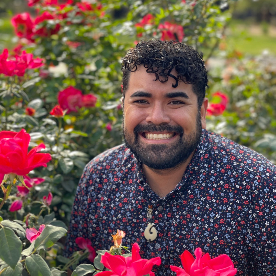 Dr. Mario Alberto Viveros Espinoza-Kulick in a field of roses