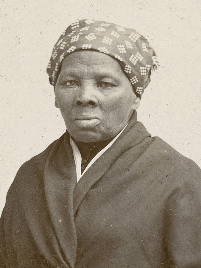 Harriet Tubman looking straight ahead in a bandana and coat