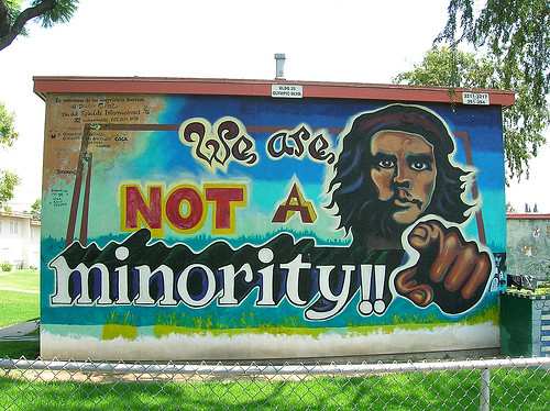 A large sign of Che with the words We are not a minority