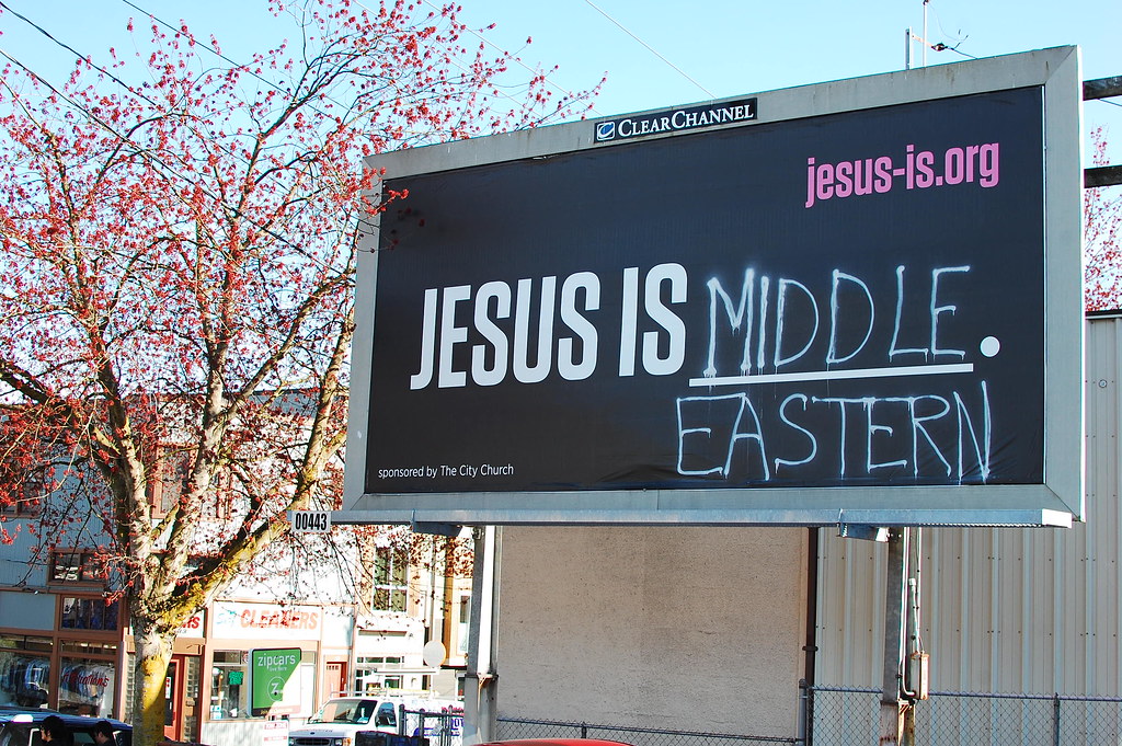 Street sign with the message Jesus is...Middle Eastern!