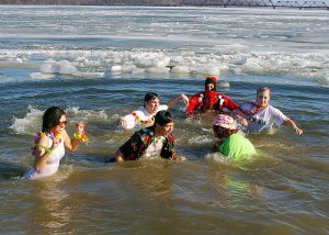 Six adults engaging in a Polar Plunge