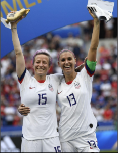 Megan Rapinoe and Alex Morgan celebrating the US Women's team win of the 2019 FIFA Women's World Cup