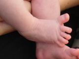 An infant's foot, when stroked, displays fanned-out toes and an upwards-curling big toe.