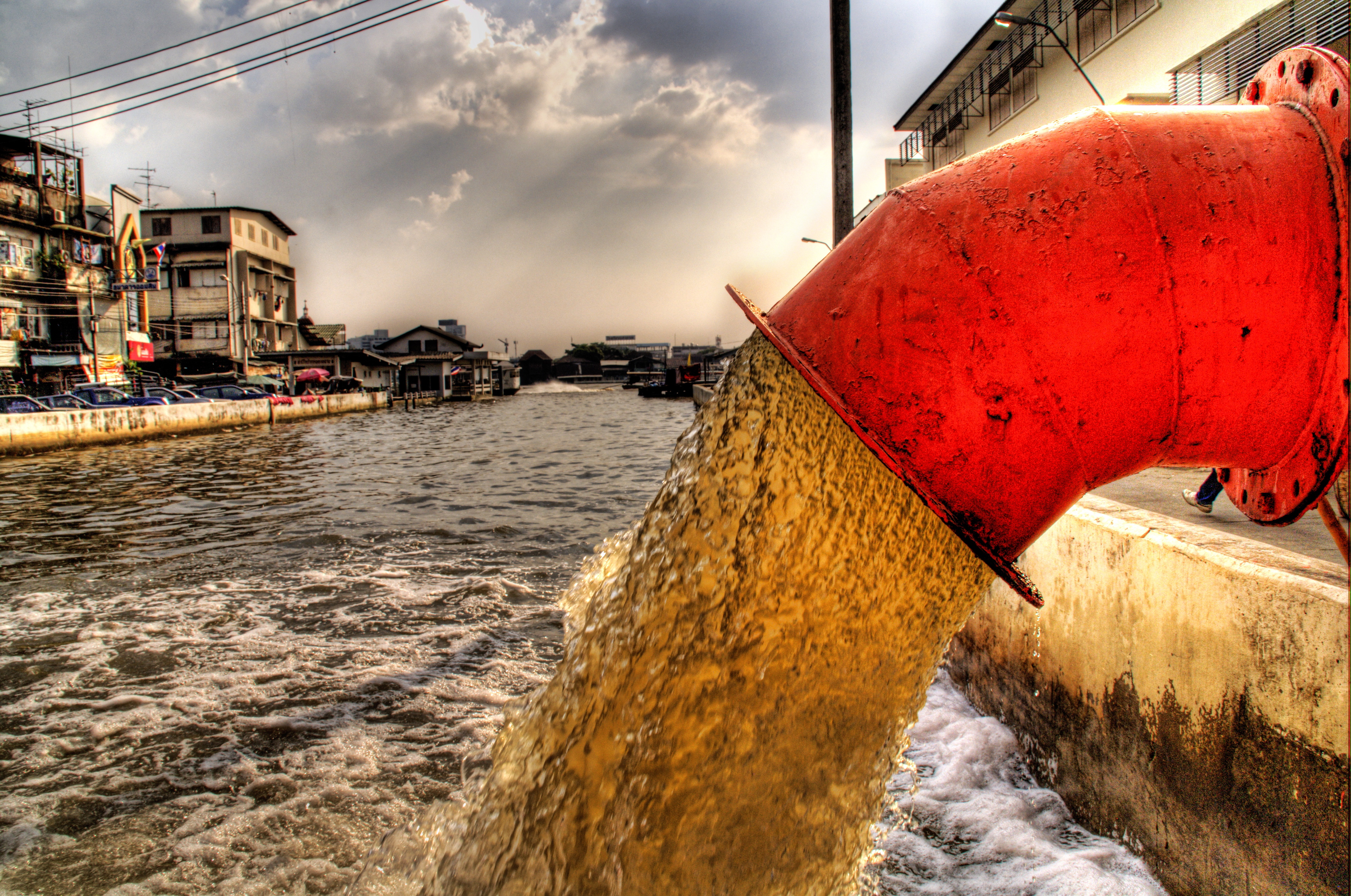 sewage pipe into river