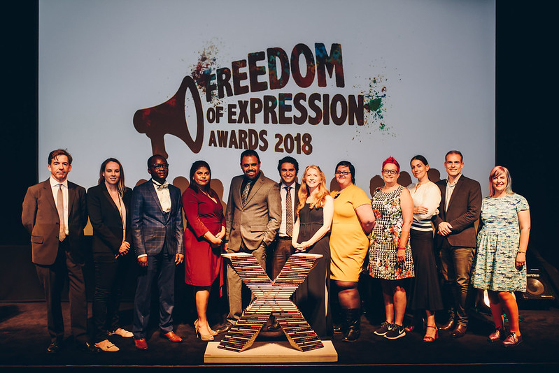 A group of people stand together to be photographed at the 2018 Freedom of Expression Awards.