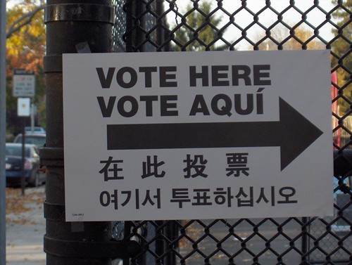 Sign with the words Vote Here Vote Aquí