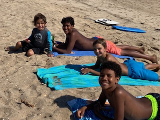 Multiracial brothers at the beach. 