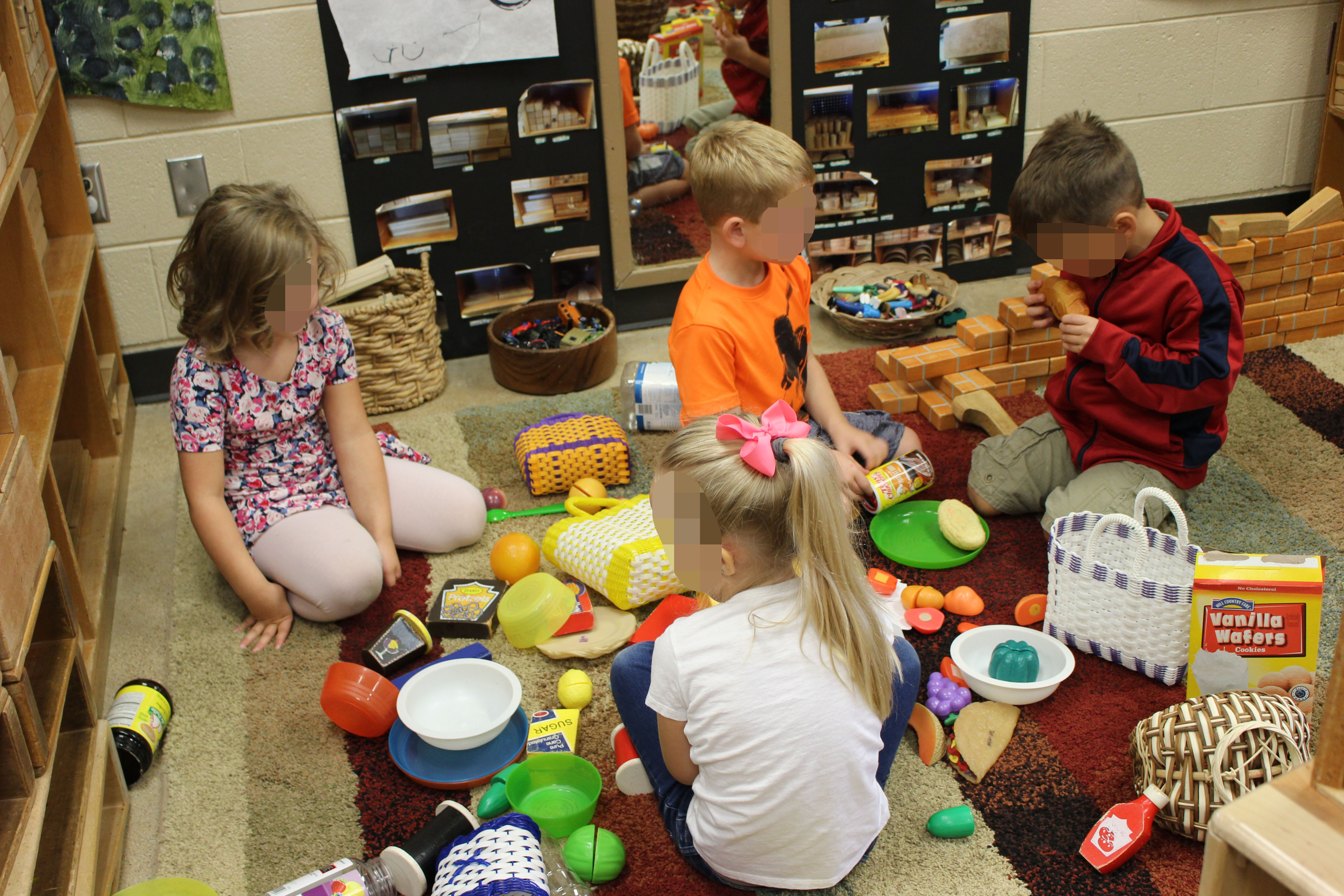 Group of children pretending to have a picnic