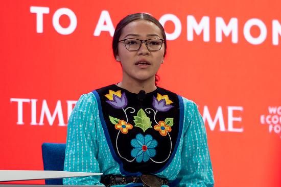 Autumn Peltier speaking on stage at the World Economic Forum