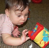 Child playing with a soft toy.