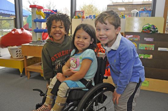3 children one in wheelchair smiling_.jpg