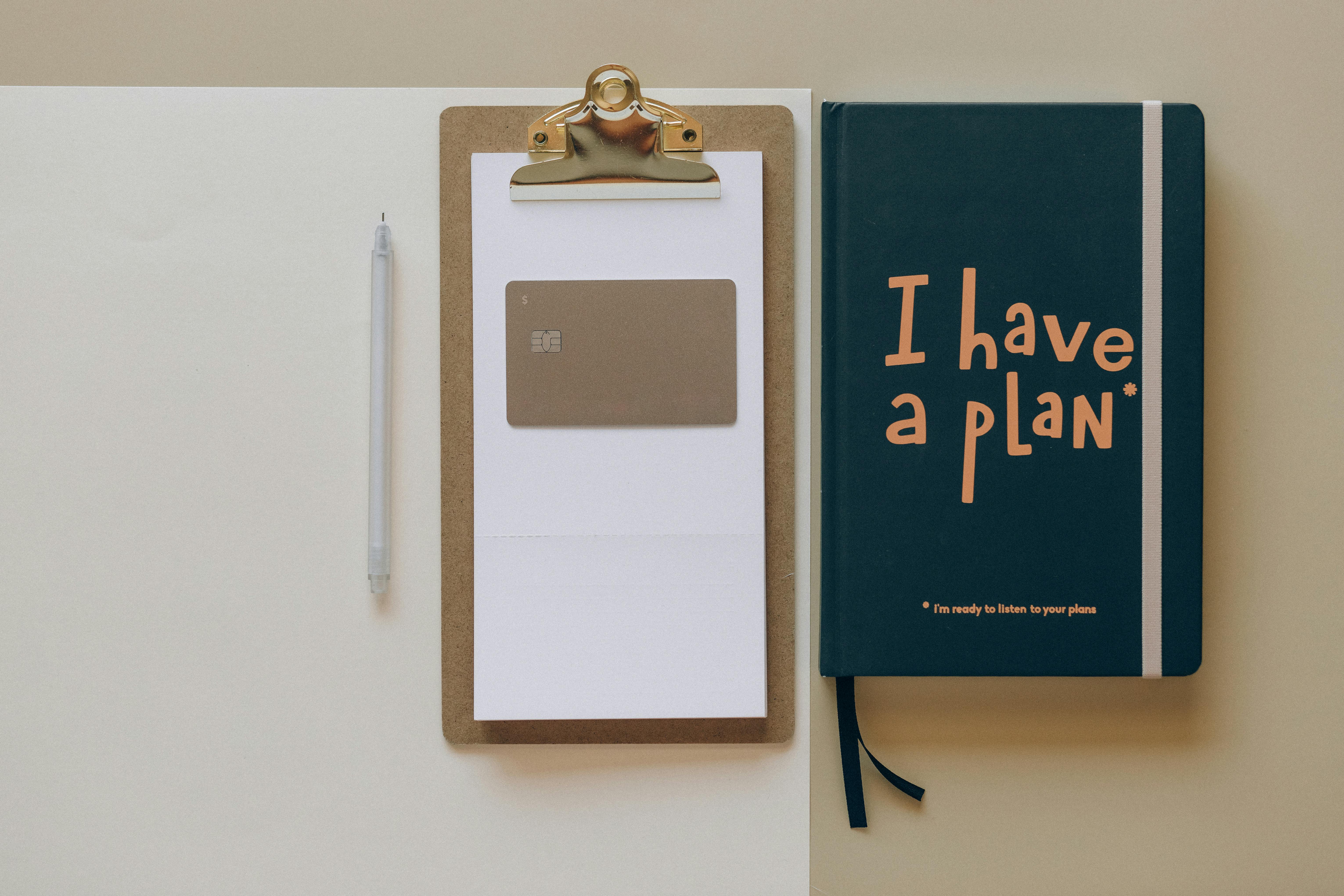Clipboard, pen, and a notebook reading “I have a plan,” symbolizing preparation for self-care planning.