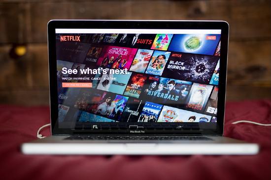 Laptop displaying the Netflix homepage on screen