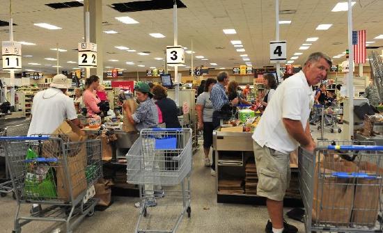 Busy supermarket checkout area