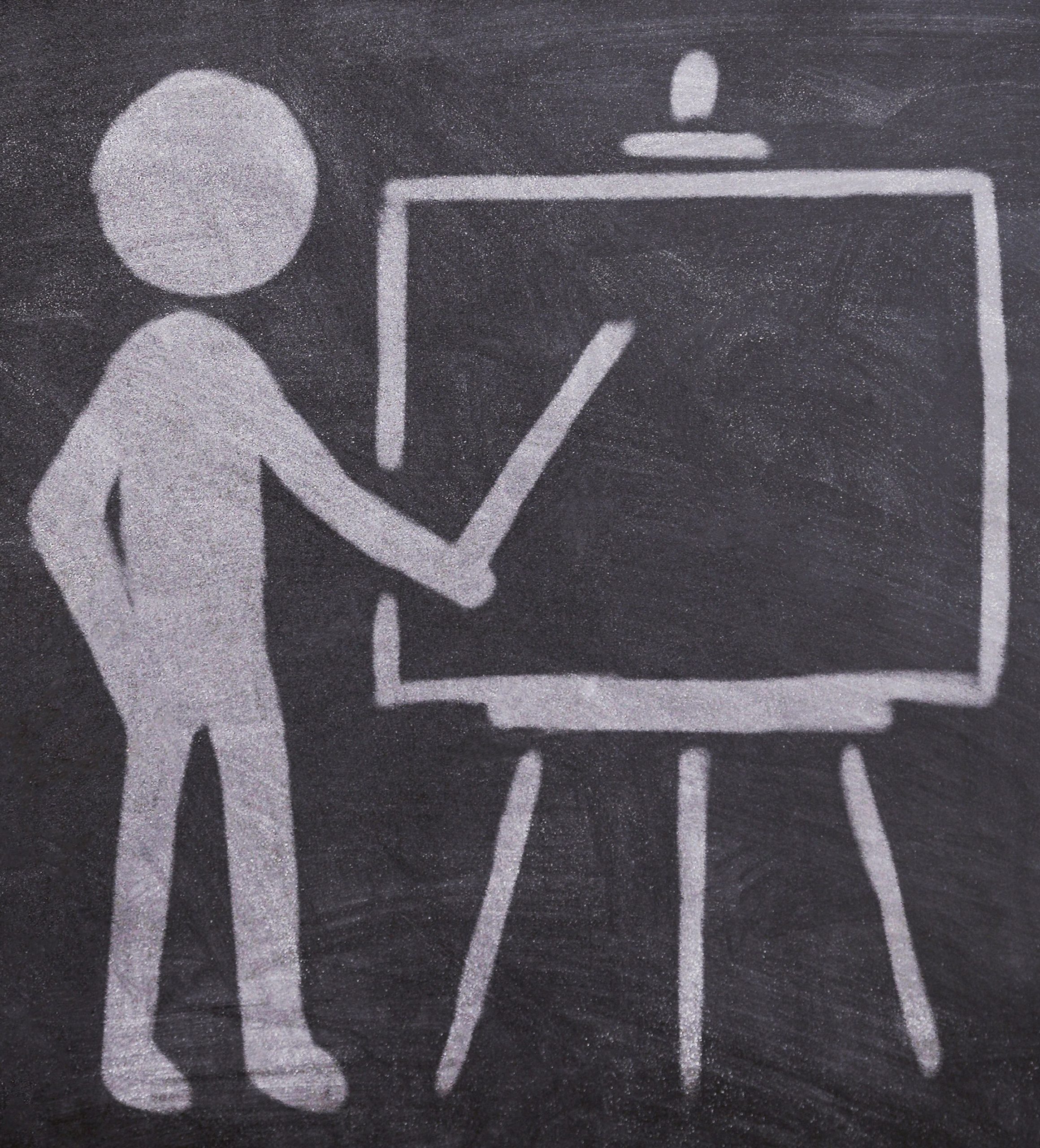 A chalk drawing on a blackboard depicts a stick figure standing next to an easel or presentation board. The figure is pointing at the board with a stick, representing teaching, presenting, or giving a lecture.