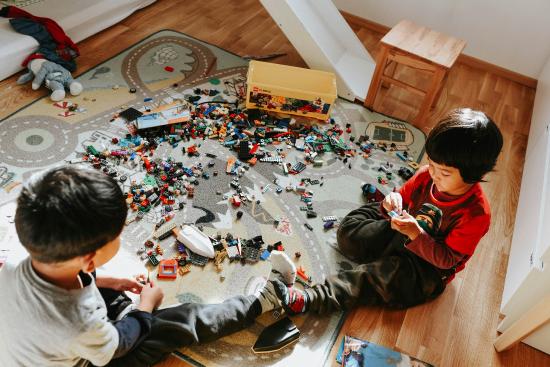 two young brothers playing with toys