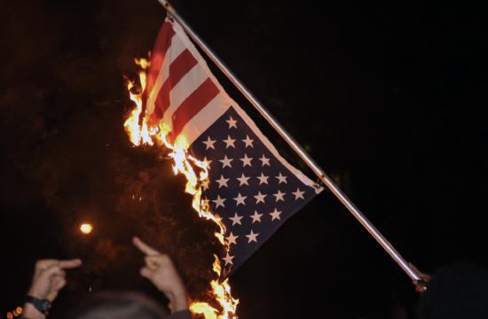 Burning the American flag is protected under the First Amendment of the U.S. Constitution as a form of symbolic speech. 