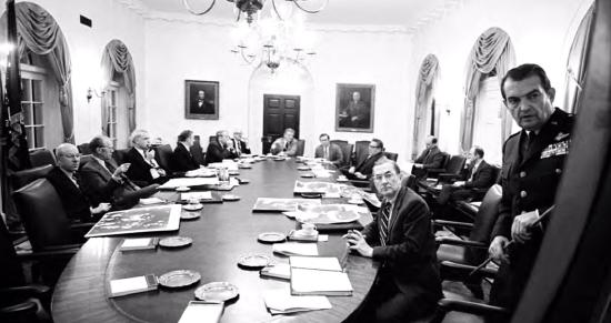 The acting chairman of the Joint Chiefs of Staff, Air Force General David C. Jones (standing), briefs the National Security Council on possible military options during the second meeting on the Mayaguez crisis in 1975.