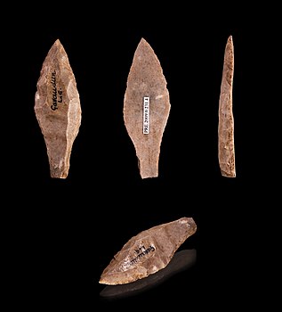 Stone tools which appear as skillfully worked stones in various arrowhead shapes with sharpened edges and pointed ends.