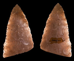Solutrean stone tools chipped to form clear arrowhead shape.