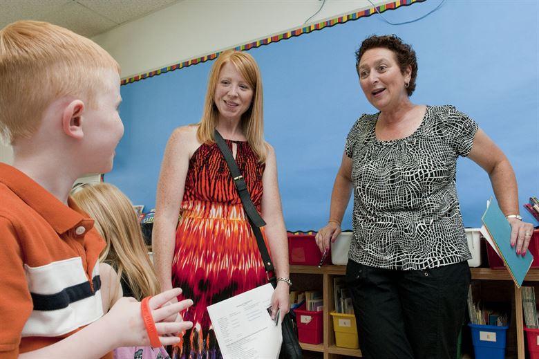 Carol Mahn (right), a first grade teacher at the Hanscom Primary School, meets Melissa Weyand and her son, Maximas, during a "Meet and Greet" at the school Aug. 30. The primary and middle schools hosted the event as a way for parents and students to meet teachers, check class lists, purchase school spirit wear and find out more about the Parent Teacher Organization before the start of the new school year. 