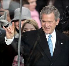 US President George Bush with a hand gesture