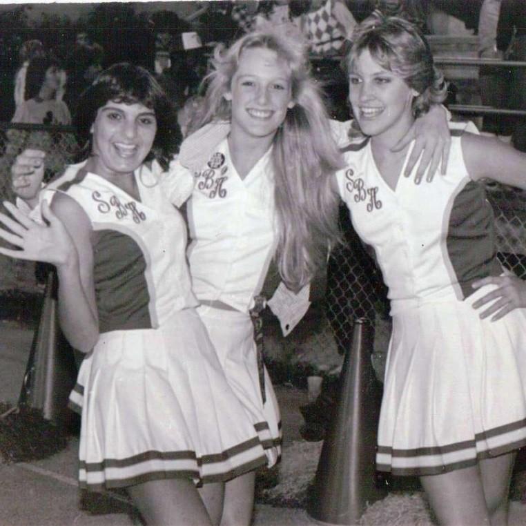 Cheerleaders pictured in a 1980s high school yearbook.