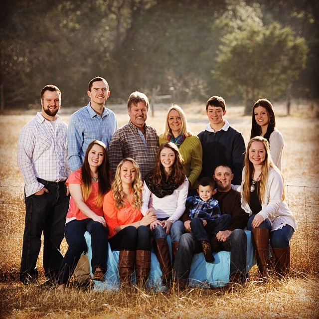 Portrait of a happy blended family including ten children.