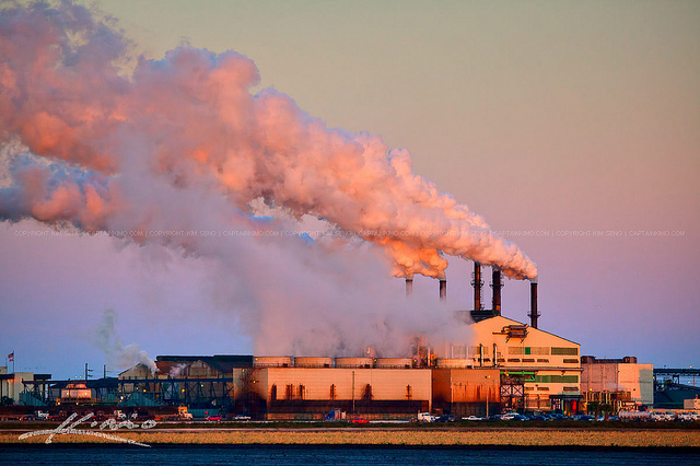 A sugar factory producing smoke pollution into the Earth