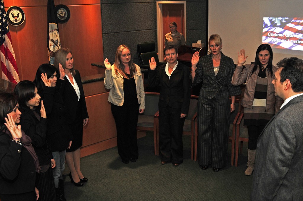 Spouses of United States service members in Italy take the oath of allegiance to become United States citizens