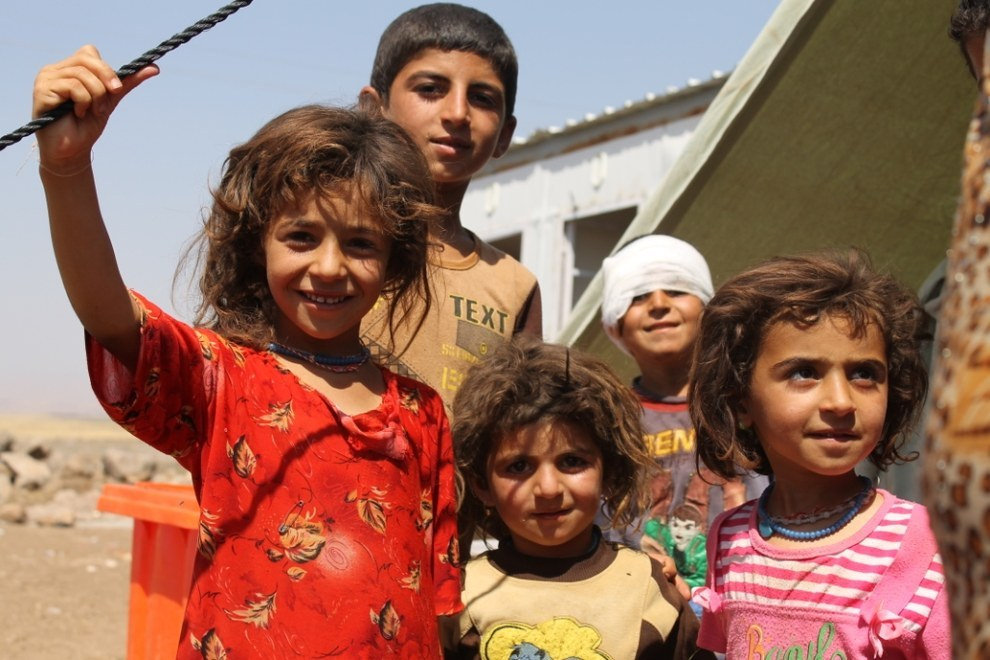 Iraqi refugee children preparing for relocation