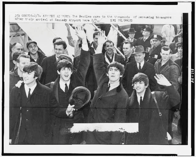 An old newspaper article featuring a picture of The Beatles