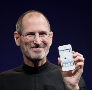Steve Jobs holding an iPhone