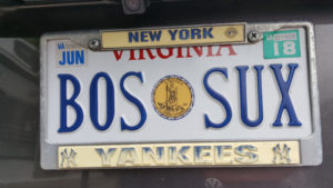A Virginia license plate is shown that says "Bos Sux" with a New York Yankees decorative placeholder around it.